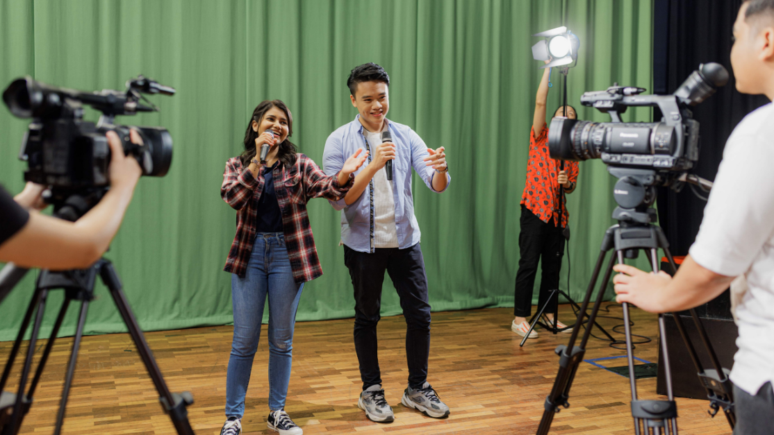 students reenacting a film with film cameras