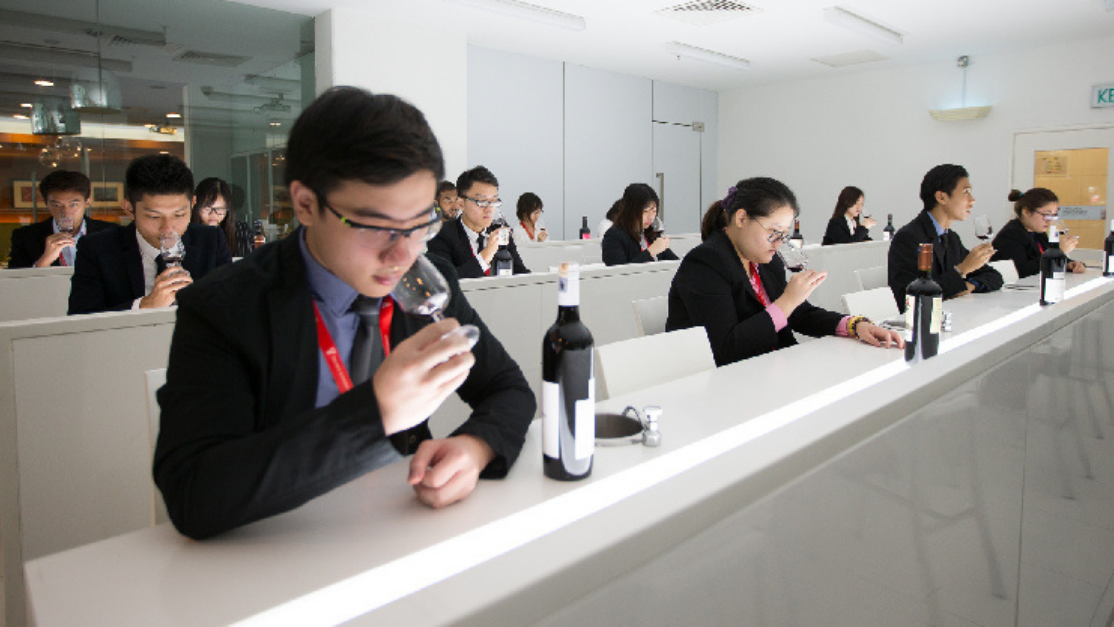 students tasting wine in a sensory lab