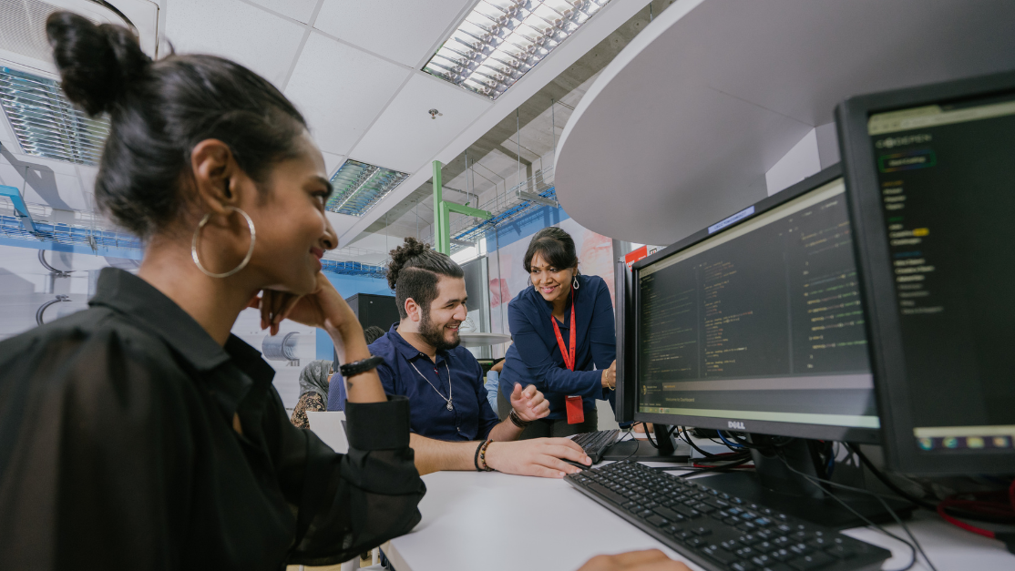 students working on a project on a computer