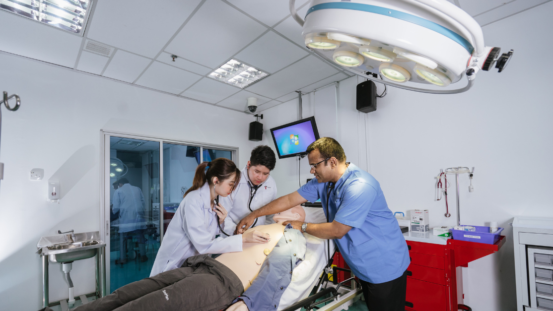 students having practical class on a cadaver
