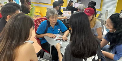 Asian parents looking at the tablet