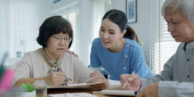 Asian parents looking at the tablet
