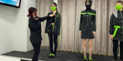 Student demonstrating the smart clothes