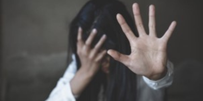 Victim of the trafficking saying no to the camera