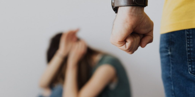 A man showing fist to a woman