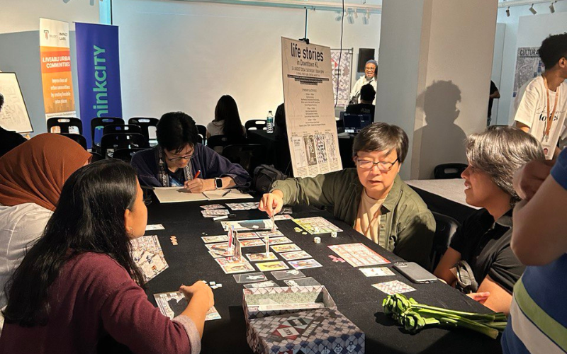 Goh Choon Ean engaging with guests through play