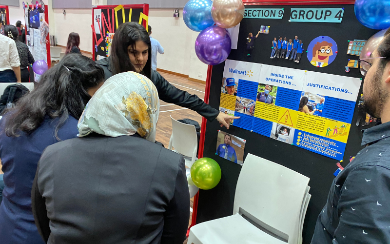 Enthusiastic students showcase their innovative findings to judges