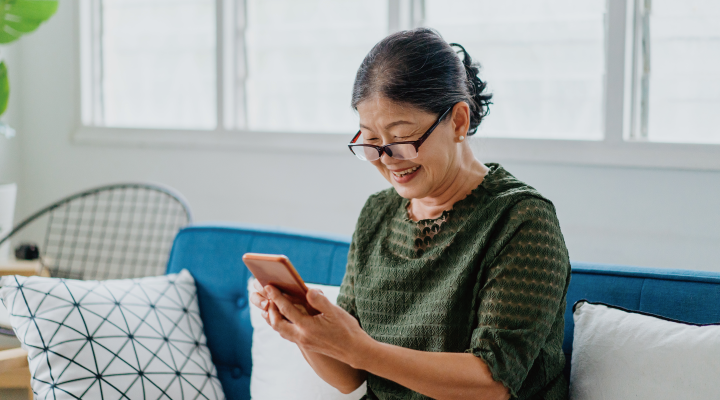 Asian elder looking at the mobile phone