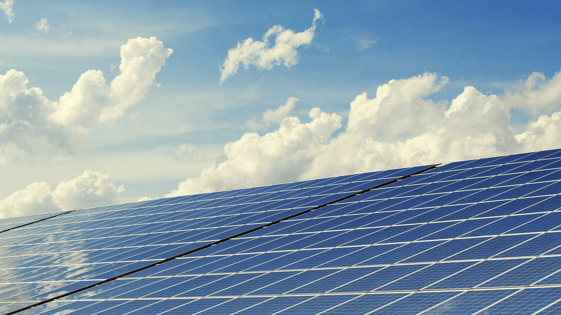 Solar panels under a blue sky