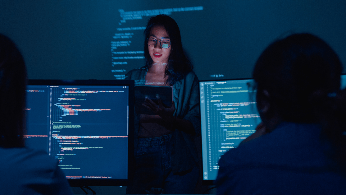 Young female developer teaching at the class