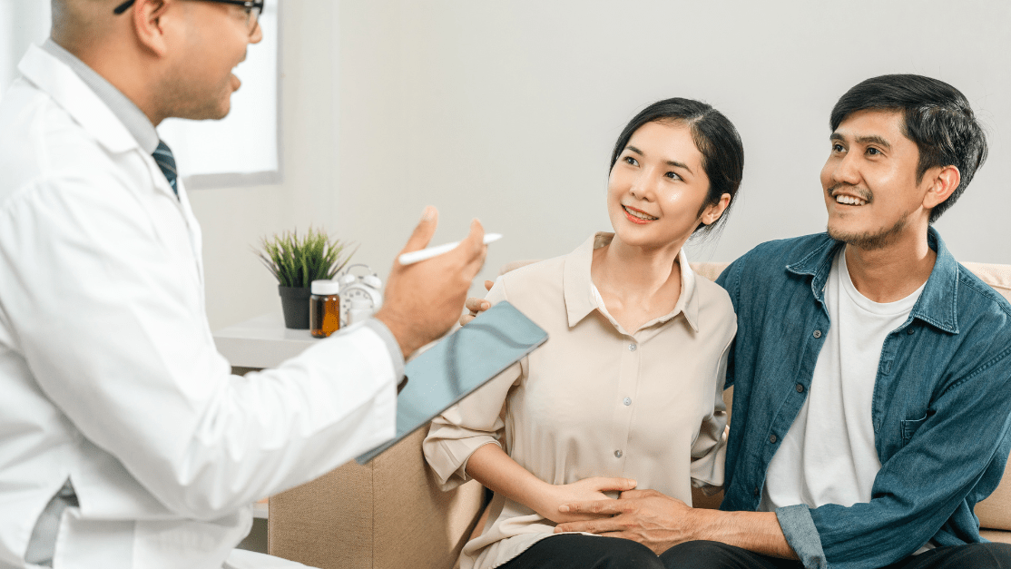 Doctor advising the young couples