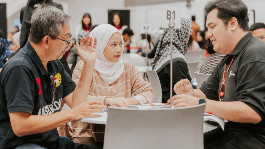 Counsellor interacting with student and her parent
