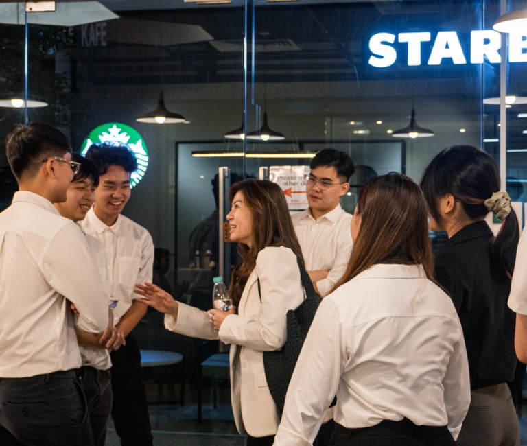 candid photo of mentor and students