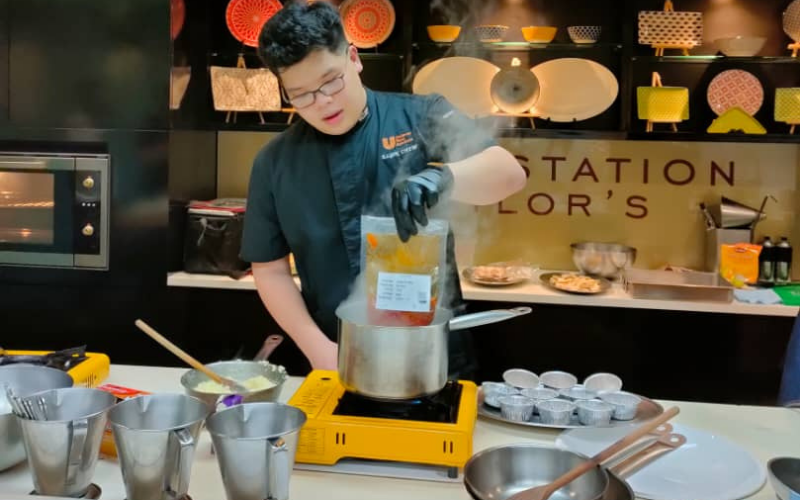 Chef showing student on preparation for the dishes