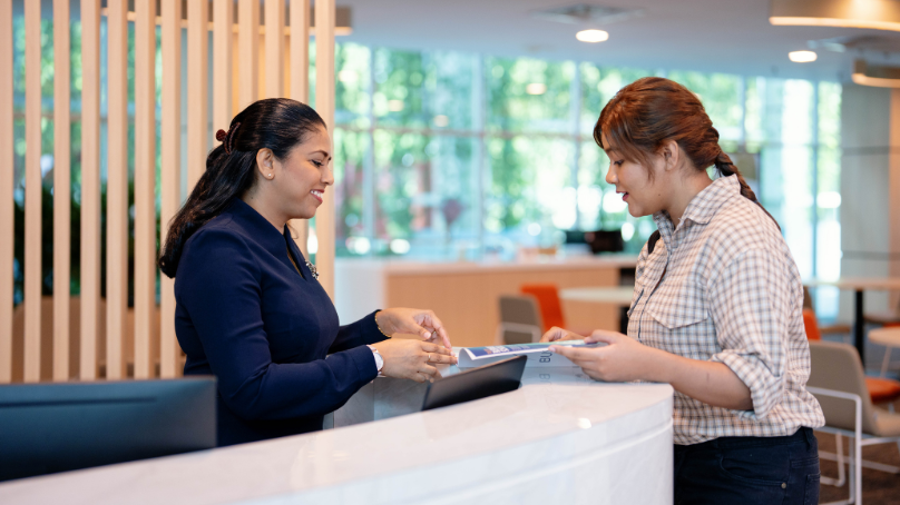 a receptionist servicing a client