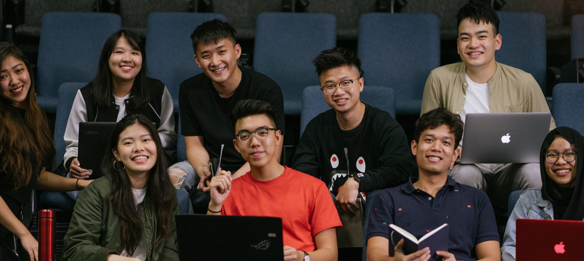 Picture of a group of people smiling at the camera
