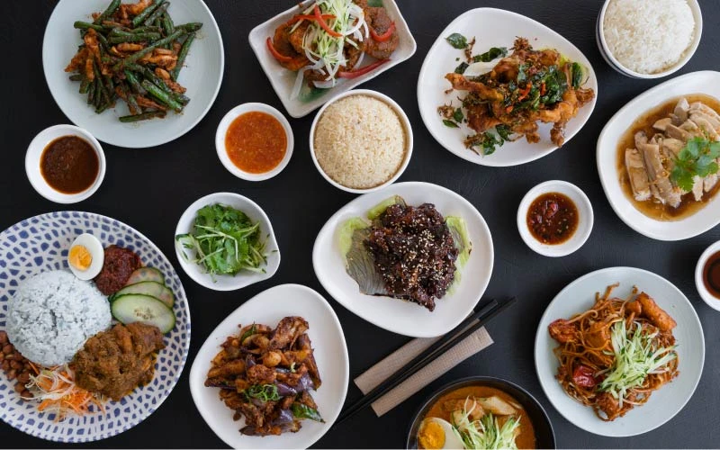 malaysian dishes laid out on table