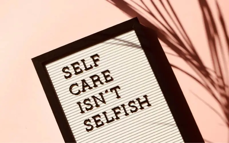 a frame with text saying "self care isn't selfish"