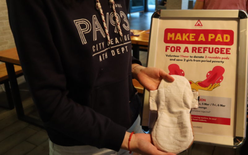 Showing the sanitary pad they created