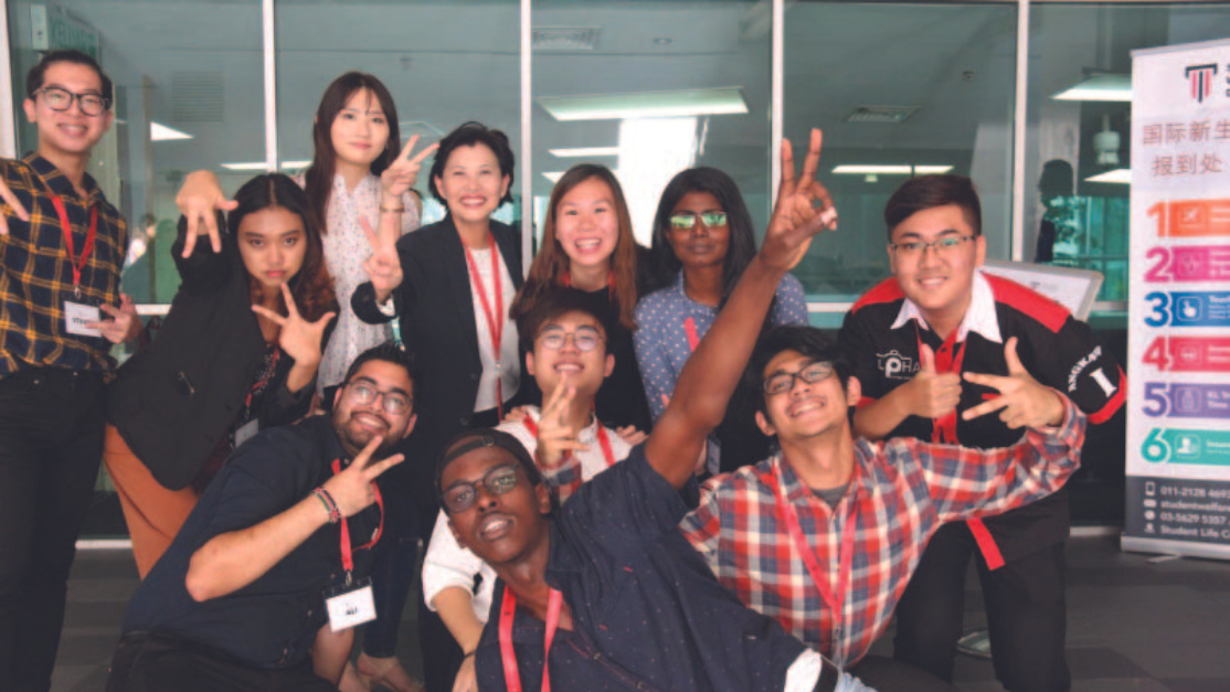 student welfare club members posing for group picture
