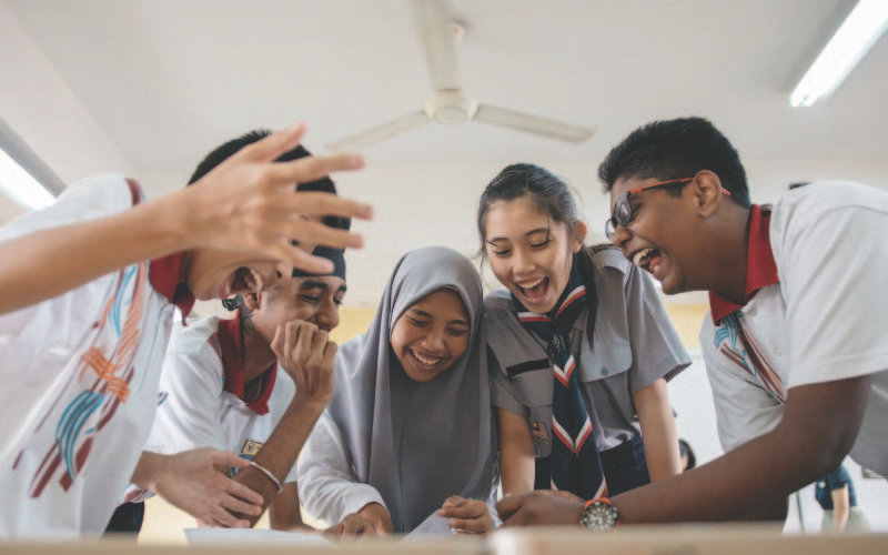 Students surrounding a table