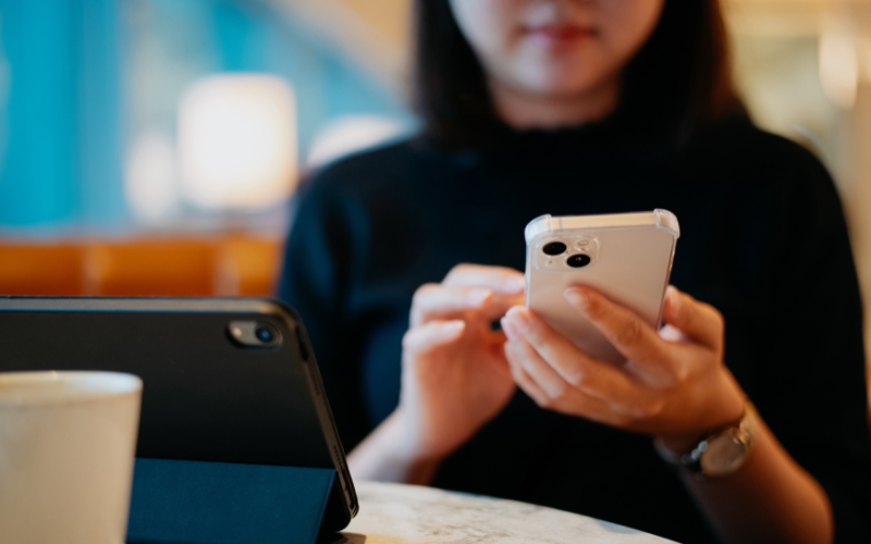 Woman scrolling through phone