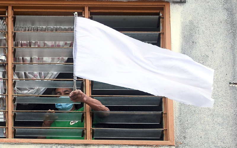 Man raising white flag