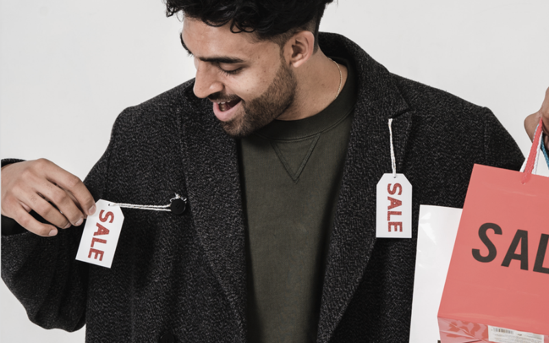Guy with sale tag on his shirt