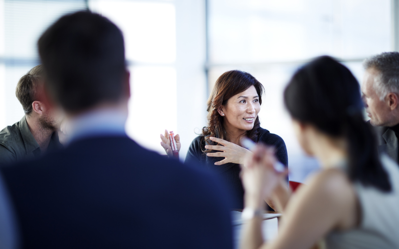 woman talking to colleagues