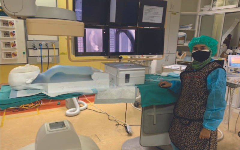 Ir. Dr. Anis Suhaila with a medical simulator.