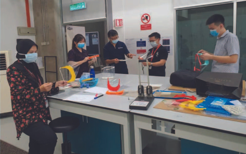 Ir. Dr. Anis Suhaila and the team at Taylor's working together to create face shields and other PPEs.
