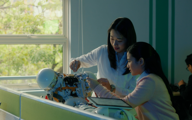 students working on a robot