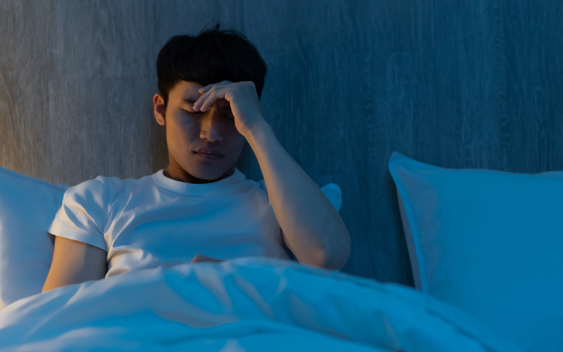 Guy sitting on the bed