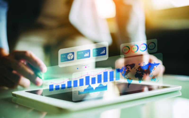 A businesswoman analysing data on a table