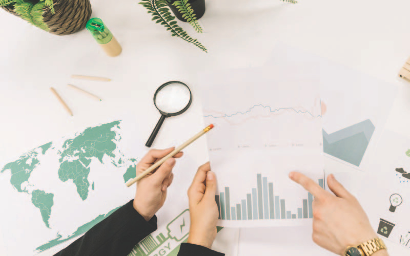 A group of people talking about carbon footprint indexes