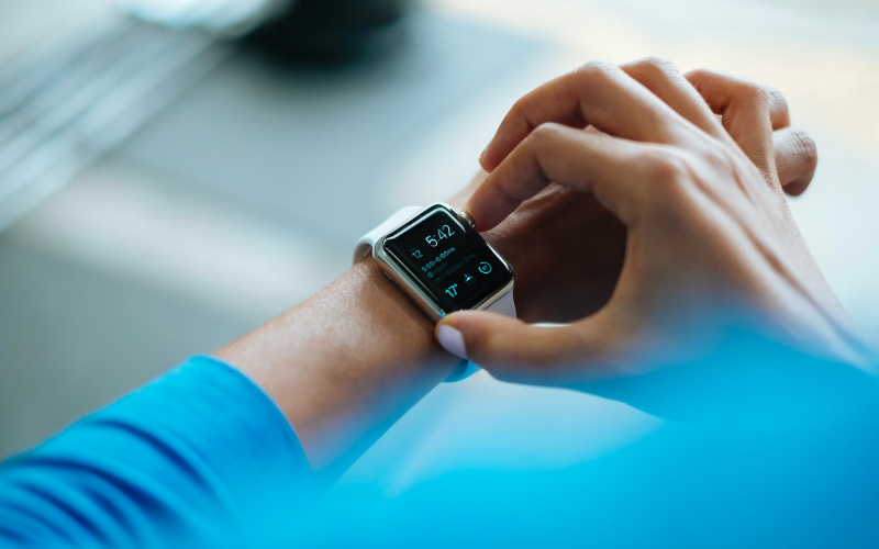 Photo showing a young lady looking at the apple watch
