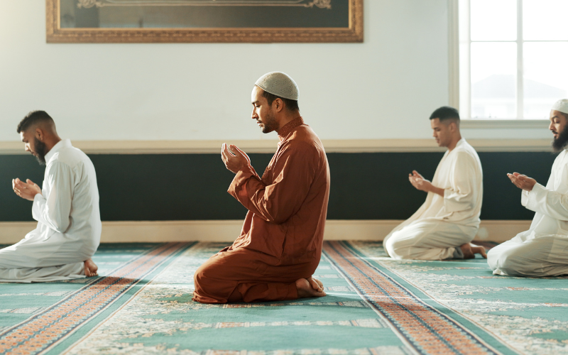 Men praying in mosque