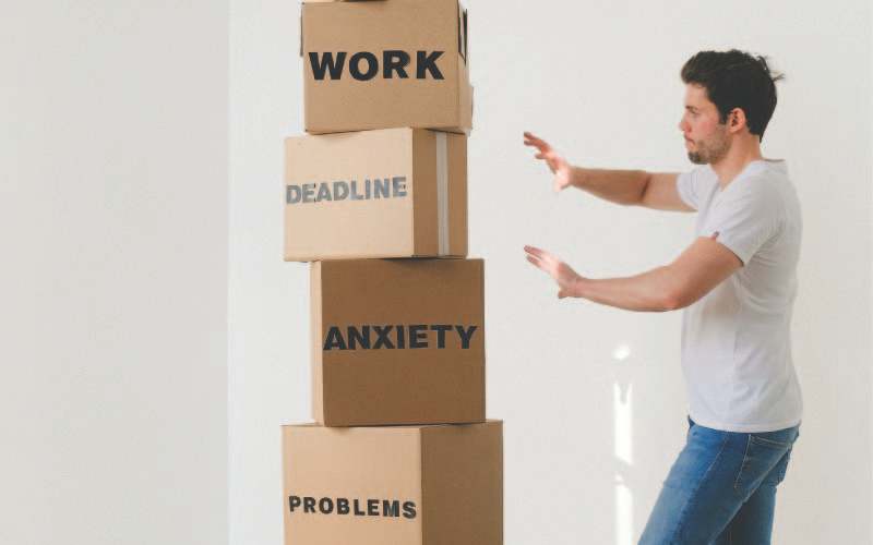 man wanting to push a stack of box