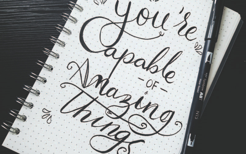 scribbled notes on a notebook