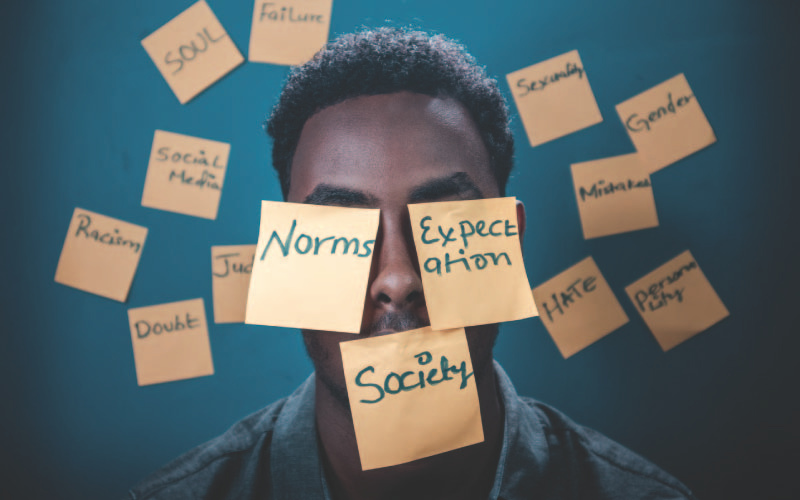 man surrounded by sticky notes