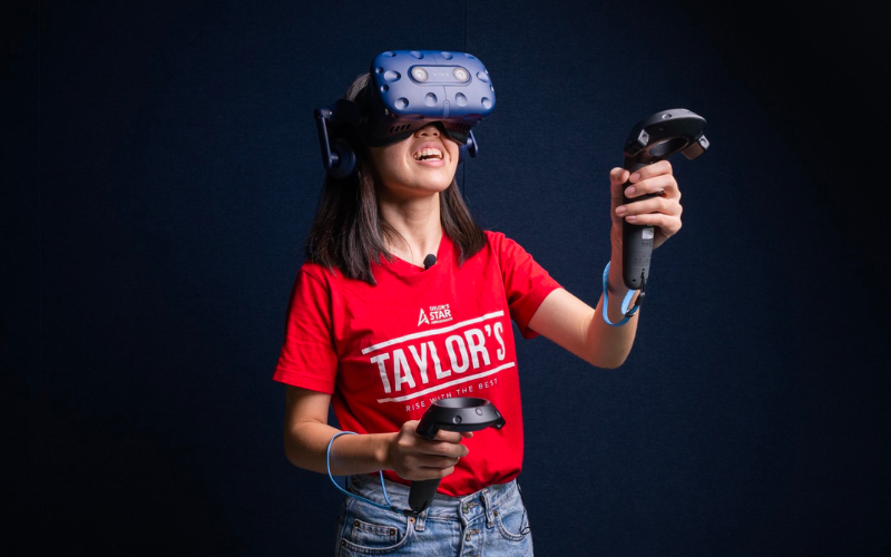 Taylor's student trying on virtual reality equipment