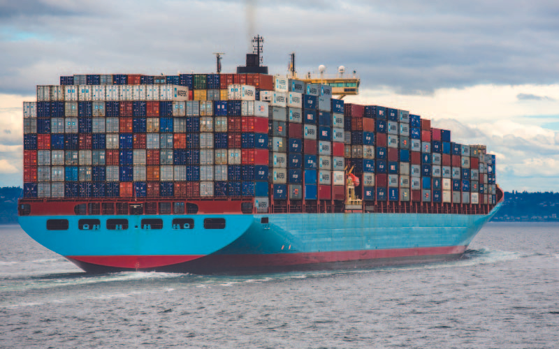 A cargo ship or freighter loaded with cargo boxes