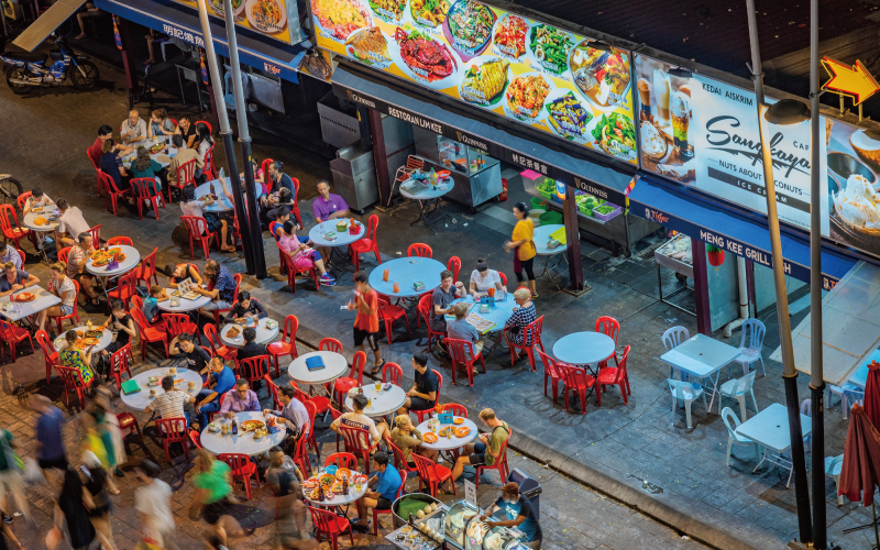 A food court with many tables in Malaysia