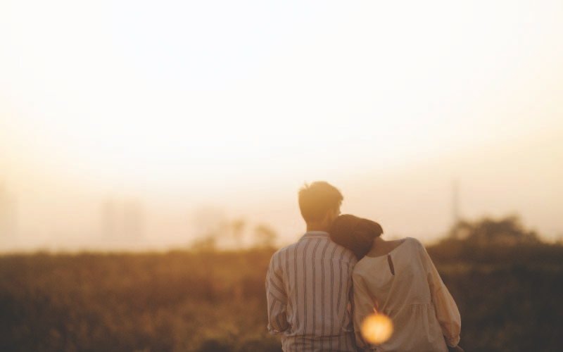 Couple leaning on each other