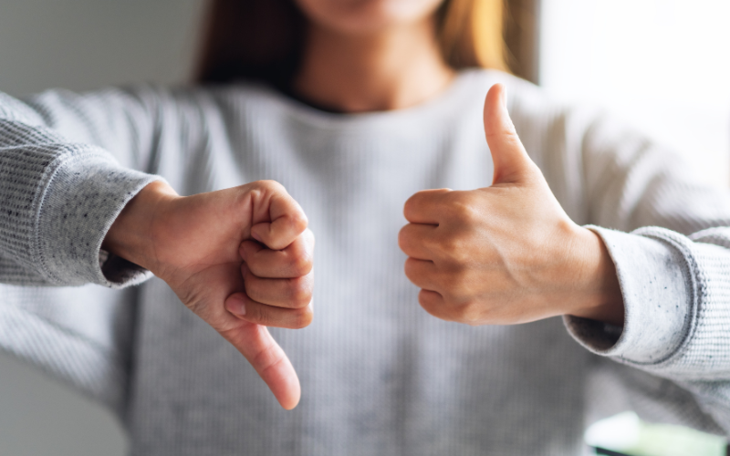 Woman making thumbs up and thumbs down