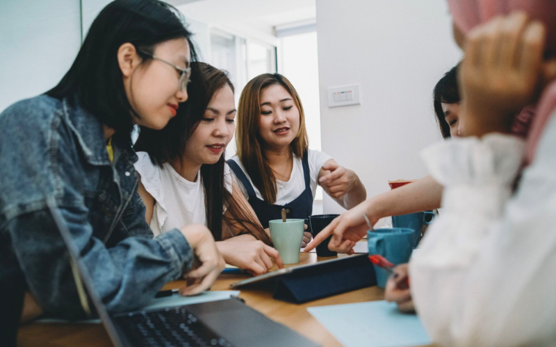 Group of Taylor's students having discussion for business project plan