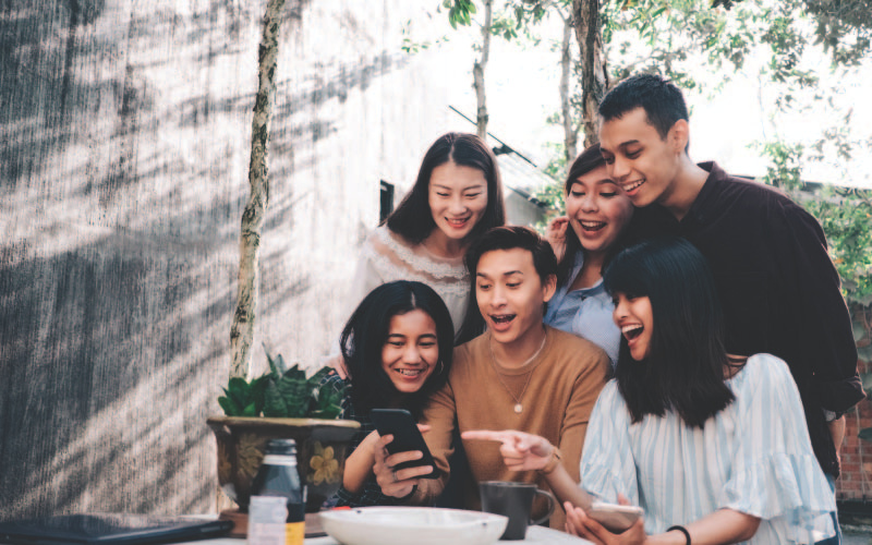 Students looking at a laptop