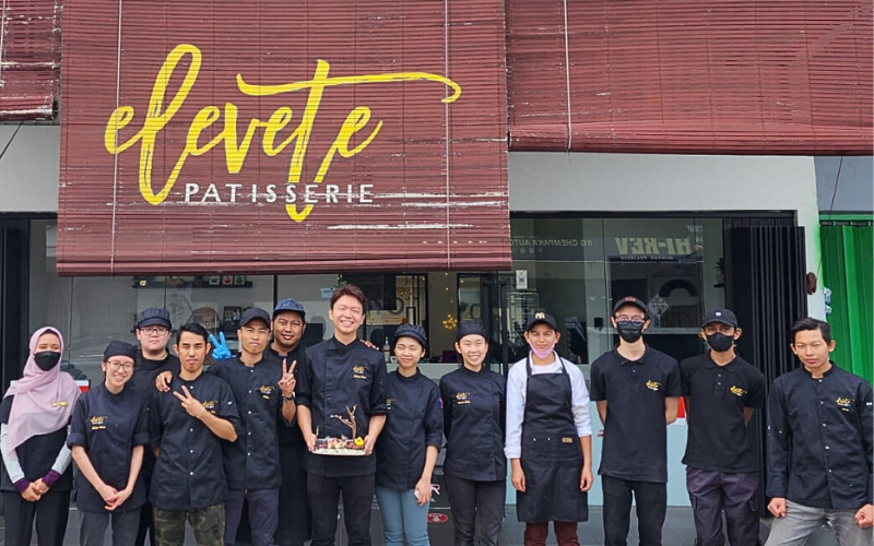 Edwin with his crews outside the shop