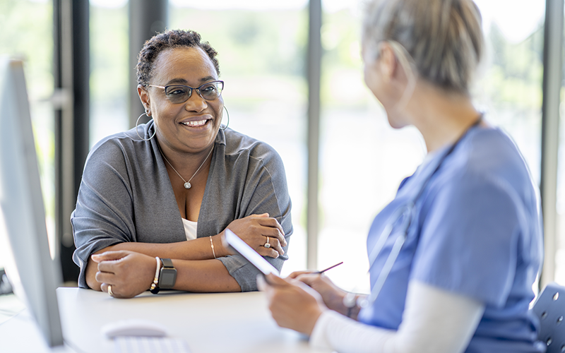 Female patient listening to female doctor