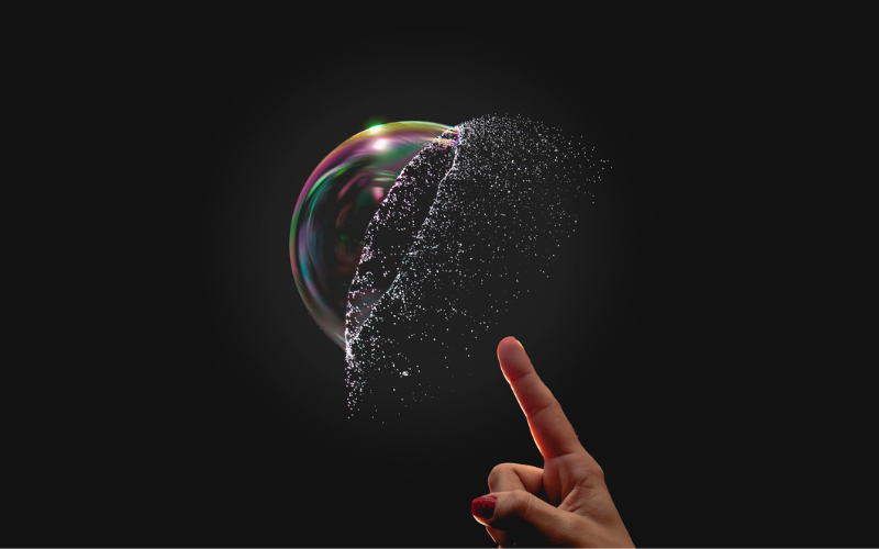 Finger reaching out to pop bubble